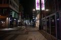 COLOGNE, GERMANY - NOVEMBER 5, 2022: Selective blur on Hohe Strasse street at night, with shops and stores closed, empty and Royalty Free Stock Photo